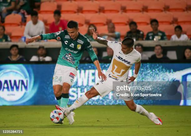 Club Leon defender Osvaldo Rodríguez and Pumas midfielder Favio Álvarez fight for the ball during the Leagues Cup semifinal soccer match between...