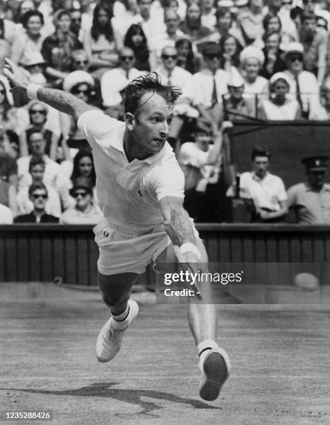 Australian tennis champion Rod Laver returns the ball, on July 06, 1968 during the Wimbledon International tournament single men's final against his...