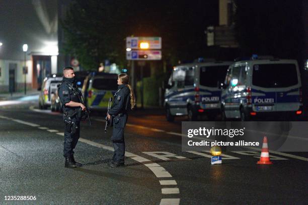 Dpatop - 15 September 2021, North Rhine-Westphalia, Hagen: Police officers block a street in the city center. Numerous police officers protect the...