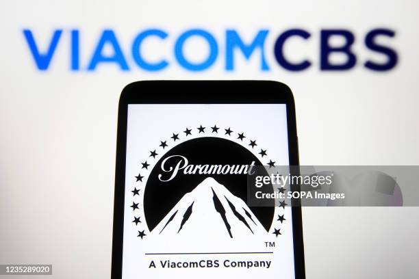 In this photo illustration, Paramount Pictures Corporation logo is seen on a smartphone screen with a ViacomCBS Inc. Logo in the background.