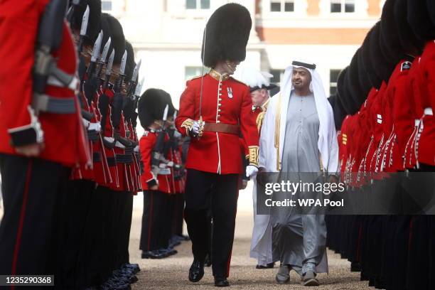 Sheikh Mohammed bin Zayed Al Nahyan, Crown Prince of Abu Dhabi inspects a Guard of Honour by the Grenadier Guards on September 16, 2021 in London,...