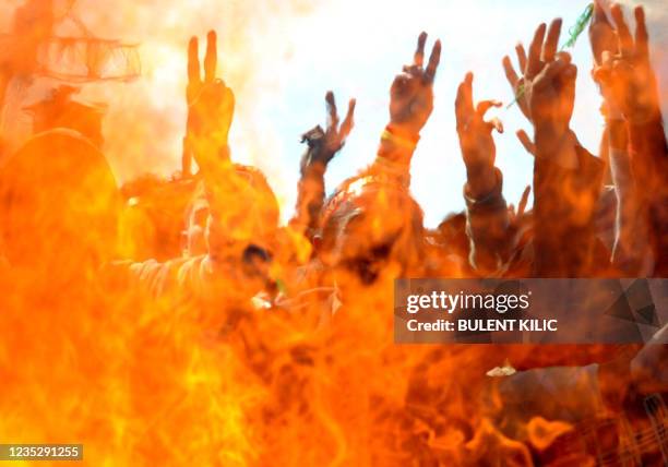 Supporters of the pro-Kurdish Peace and Democracy Party celebrate the Newroz, the new year, in Istanbul on March 21, 2010. Newroz Day, which marks...