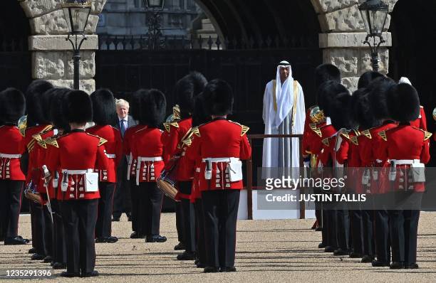 Britain's Prime Minister Boris Johnson and Crown Prince of Abu Dhabi, Mohamed bin Zayed Al Nahyan inspect the Guard of Honour in central London, on...