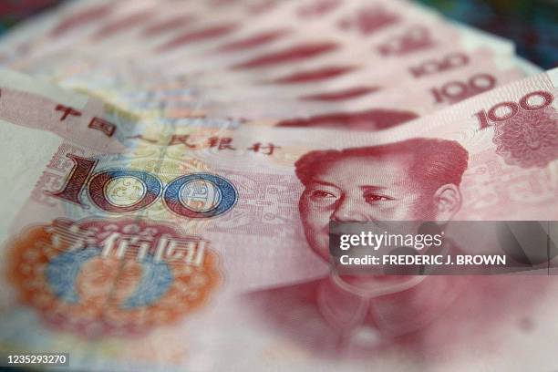 An illustration of Chinese currency, with former leader Mao Zedong's image of a 100 yuan note, 03 September 2003 in Beijing. China is coming under...