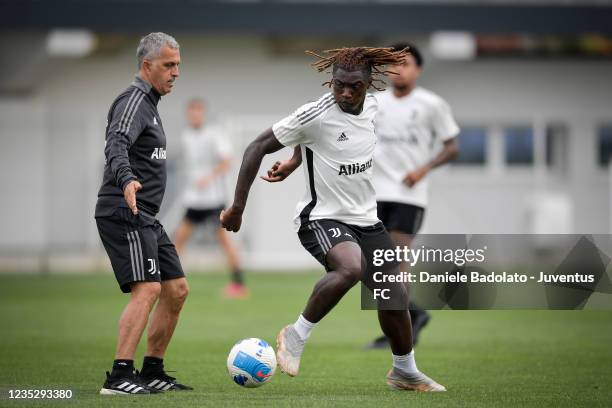 Juventus player Moise Kean with Aldo Dolcetti during a training session at JTC on September 16, 2021 in Turin, Italy.