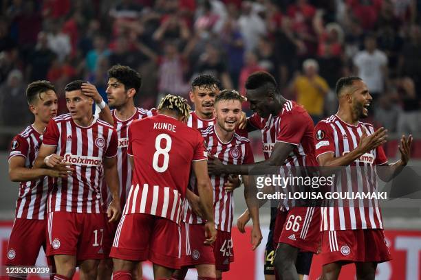 Olympiacos' Moldovan defender Oleg Reabciuk celebrates with teammates after scoring a goal during the UEFA Europa League Group D football match...
