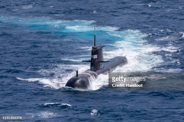 In this handout image provided by the Australian Defence Force, Royal Australian Navy submarine HMAS Rankin is seen during AUSINDEX 21, a biennial...