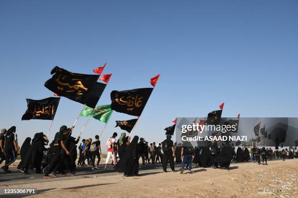 Iraqi Shiite Muslim pilgrims march in the country's southern province of al-Muthanna to the holy city of Karbala, ahead of the Arbaeen religious...