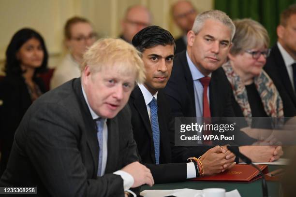 Prime minister Boris Johnson flanked by Britain's Chancellor of the Exchequer Rishi Sunak speaks at the first post-reshuffle cabinet meeting in...