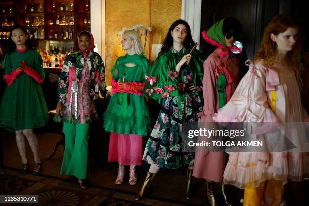 Models wait back stage for the start of London-based Turkish designer Bora Aksu catwalk show for the Spring/Summer 2022 collection on the first day...