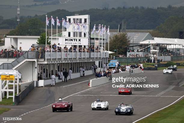 Cars taking part in a practice session for the Sussex Trophy, a race for sports cars from 1955 to 1960 at the Goodwood Revival 2021, north of...