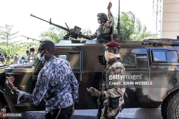 President of the National Committee for Rally and Development Colonel Mamady Doumbouya arrives in a military vehicle with his team of Special Forces...