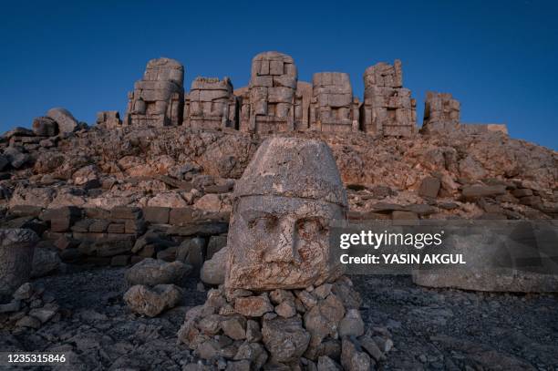 This photograph shows massive stone head statues at the archaeological site of Mount Nemrut in Adiyaman, southeastern Turkey, on September 17, 2021....