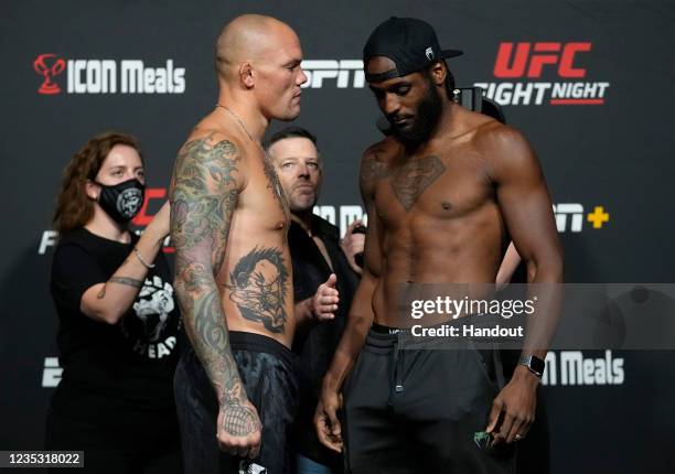 In this UFC handout, Opponents Anthony Smith and Ryan Spann face off during the UFC Fight Night weigh-in at UFC APEX on September 17, 2021 in Las...