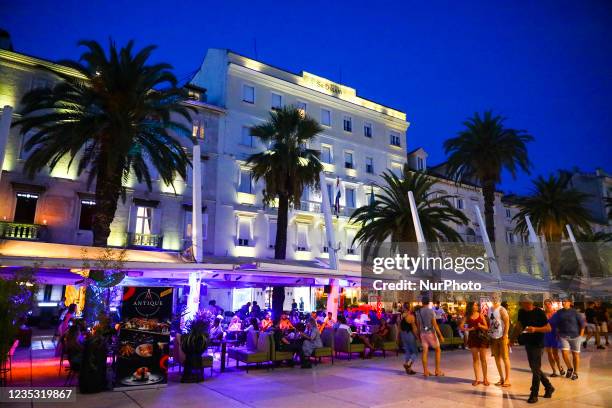 Palm trees at the Riva Promenade in the evening in Split, Croatia on September 14, 2021.