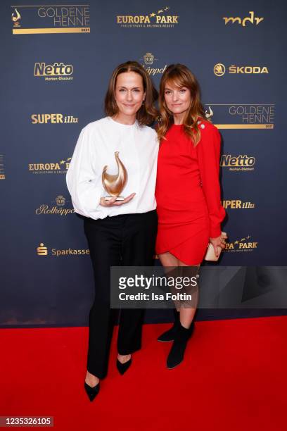 Actress and award winner Claudia Michelsen and actress Ina Paule Klink attends the Goldene Henne Award 2021 at Kongresshalle am Zoo Leipzig on...