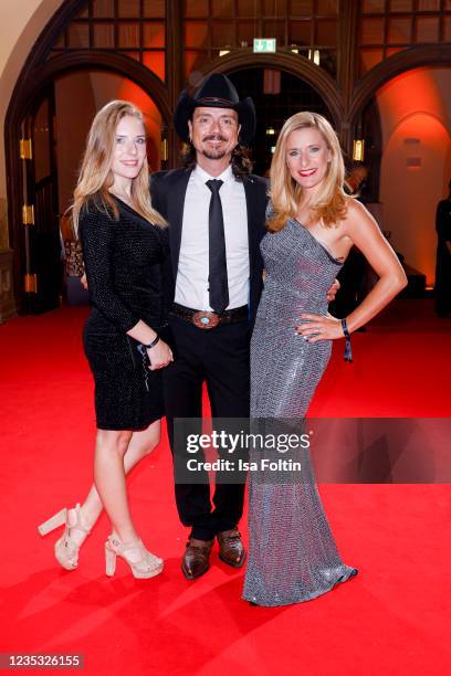 Singer Stefanie Hertel, Lanny Lanner and Johanna Mross attend the Goldene Henne Award 2021 at Kongresshalle am Zoo Leipzig on September 17, 2021 in...