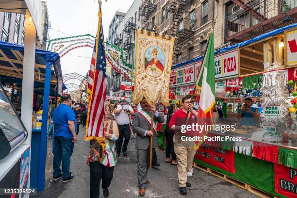 People participate in a parade to celebrate the "Feast of San Gennaro 2021" in Little Italy. This is an annual festivities held in the Little Italy...