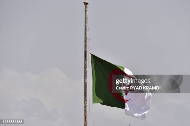 The Algerian national flag flies at half mast in the capital Algiers on September 18 following the death of former president Abdelaziz Bouteflika. -...