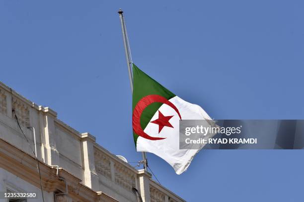 The Algerian national flag flies at half mast in the capital Algiers on September 18 following the death of former president Abdelaziz Bouteflika. -...