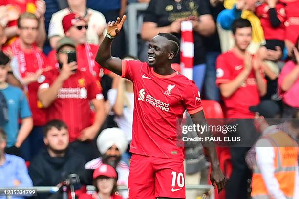 Liverpool's Senegalese striker Sadio Mane celebrates after scoring the opening goal of the English Premier League football match between Liverpool...