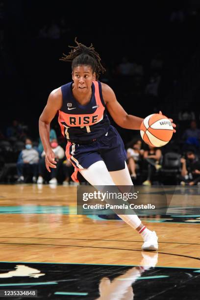 Ariel Atkins of the Washington Mystics dribbles the ball against the New York Liberty on August 12, 2021 at Barclays Center in Brooklyn, New York....