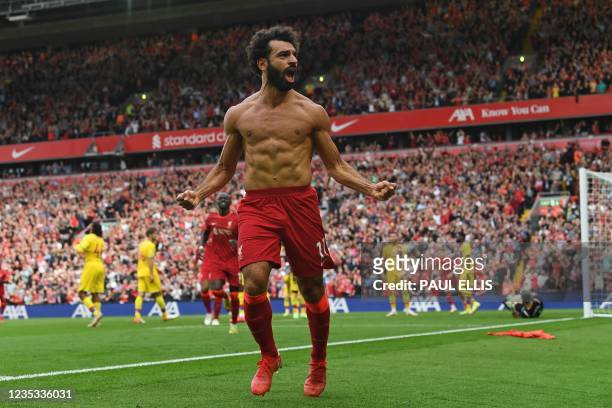Liverpool's Egyptian midfielder Mohamed Salah celebrates after scoring their second goal during the English Premier League football match between...