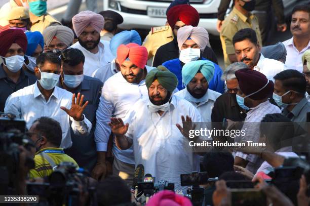 Captain Amarinder Singh interacts with the media outside Punjab Raj Bhawan after submitting a resignation from the post of Punjab Chief Minister to...