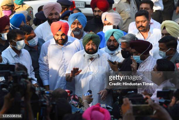 Former Punjab chief minister Captain Amarinder Singh interacts with the media outside Punjab Raj Bhawan after submitting his resignation to the...