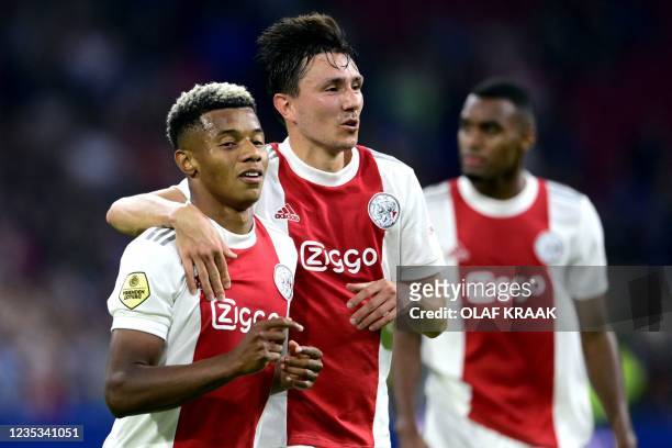 Ajax' Brazilian forward David Neres and Dutch forward Steven Berghuis celebrate their fourth goal during the Dutch Eredivisie football match between...