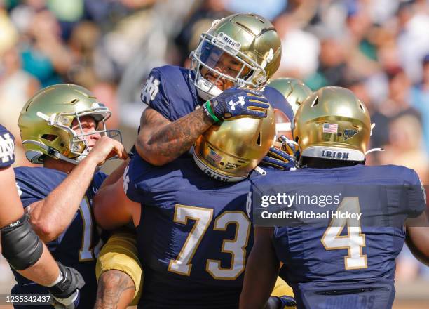 Kyren Williams of the Notre Dame Fighting Irish celebrates with teammates after a touchdown against the Purdue Boilermakers during the first half at...