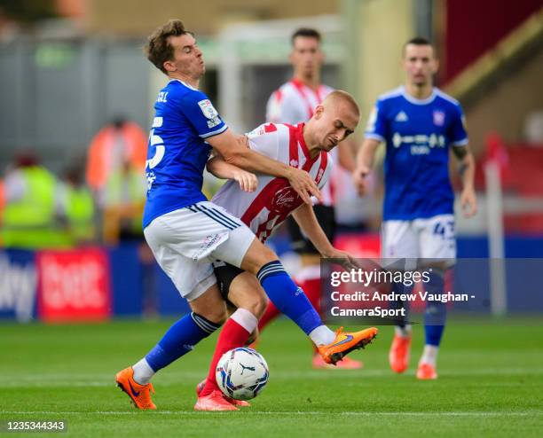 Lincoln City's Lewis Fiorini battles with Ipswich Town's Tom Carroll during the Sky Bet League One match between Lincoln City and Ipswich Town at...