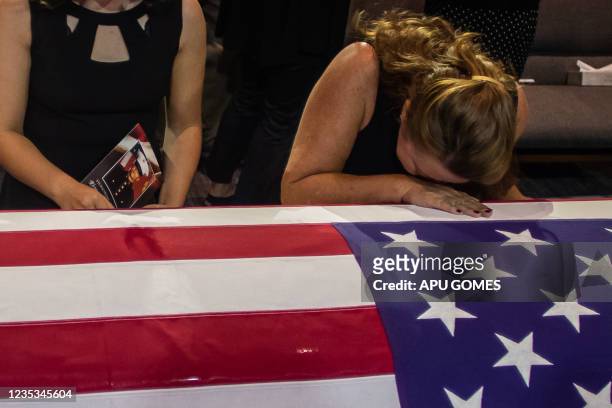 People pay their respects during the funeral of Marine Lance Cpt. Kareem Grant Nikoui at the Harvest Christian Fellowship on September 18, 2021 in...