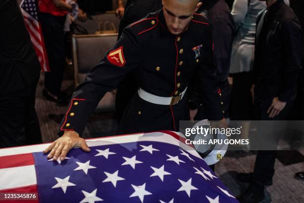 People pay their respects during the funeral of Marine Lance Cpt. Kareem Grant Nikoui at the Harvest Christian Fellowship on September 18, 2021 in...