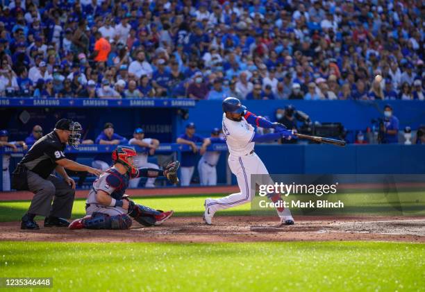 Teoscar Hernandez of the Toronto Blue Jays hits a three run home run against the Minnesota Twins in the fourth inning during their MLB game at the...