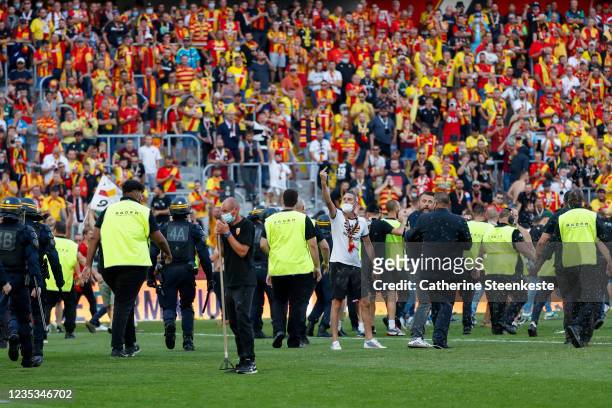Large group of Lens supporters invaded the field and ran to the away section where they fought with Lille fans during the half time of the Ligue 1...