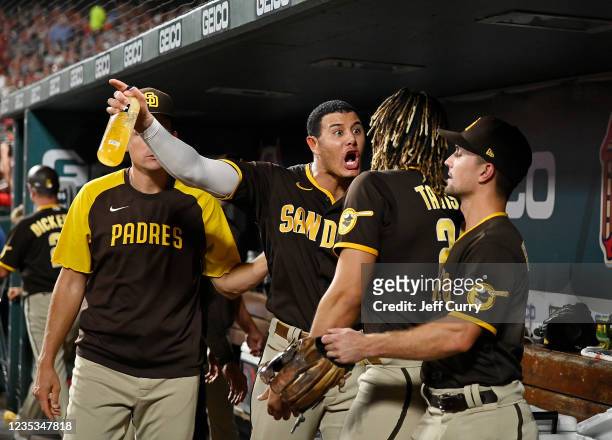 Manny Machado and Fernando Tatis Jr. #23 of the San Diego Padres exchange words in the dugout during the fifth inning against the St. Louis Cardinals...