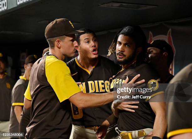 Manny Machado and Fernando Tatis Jr. #23 of the San Diego Padres exchange words in the dugout during the fifth inning against the St. Louis Cardinals...