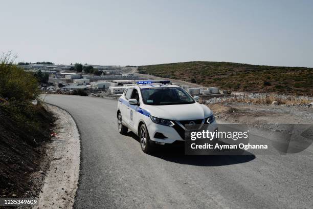 Greek police vehicle seen near the entrance of the new centre for asylum seekers on September 18, 2021 in Samos, Greece. The center, described as "a...