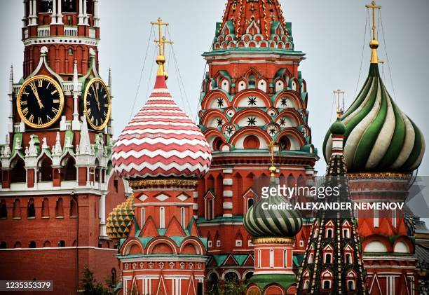 View of the Kremlin's Spasskaya tower and St. Basil's cathedral taken during the last day of the three-day parliamentary and local elections in...