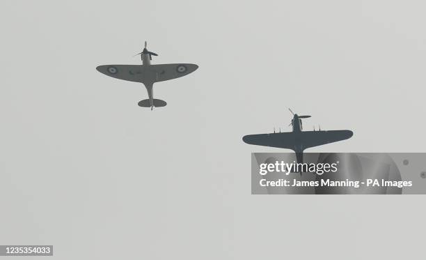 Flypast by a Hurricane and a Spitfire over Westminster Abbey, London, after attending a service of Thanksgiving and Rededication to commemorate the...