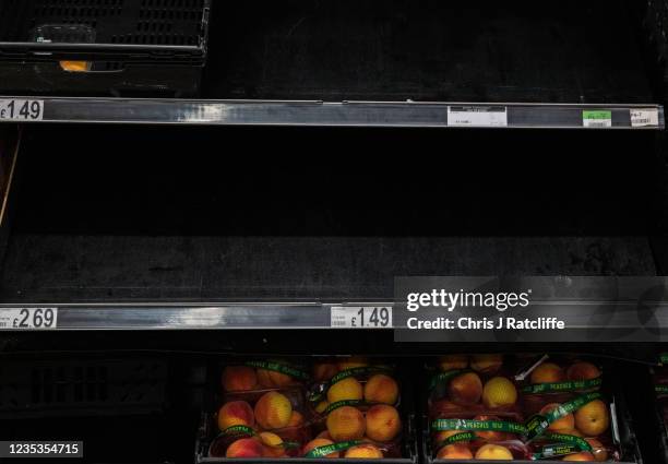 Empty shelves in the fruit aisle at Asda Supermarket, Greenwich Peninuslar, on September 19, 2021 in London, England. Gaps in supermarket shelves...