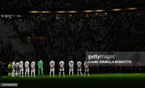 Juventus' players and AC Milan'players observe a minute of silence in hommage to late Italian football player Francesco Morini before the Italian...