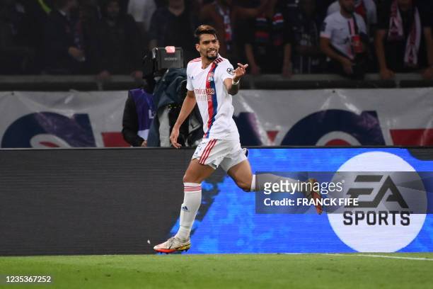 Lyon's Brazilian midfielder Lucas Paqueta celebrates scoring his team's first goal during the French L1 football match between Paris-Saint Germain...