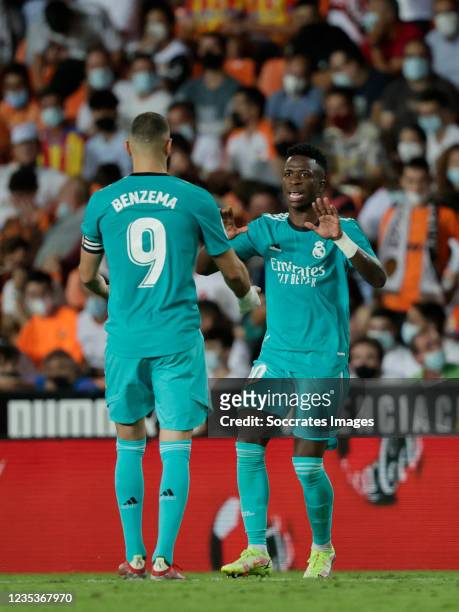 Vinicius Junior of Real Madrid celebrates 1-1 with Karim Benzema of Real Madrid during the La Liga Santander match between Valencia v Real Madrid at...