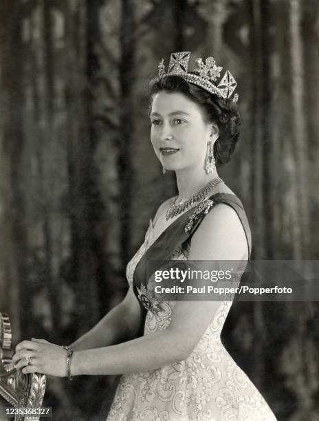 Queen Elizabeth II wearing the Ribbon and Star of the Garter and diamond jewellery including the diamond diadem reset for Queen Victoria, in the...