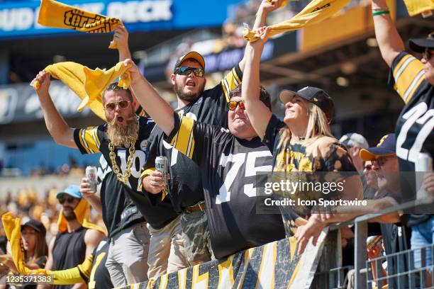 Pittsburgh Steelers fans wave their terrible towels and cheer during the game on September 19, 2021 at Heinz Field in Pittsburgh, PA.