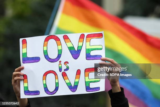 Participant holds a placard which says Love is love during the Equality March KyivPride 2021 of the LGBT community. Thousands of participants turned...