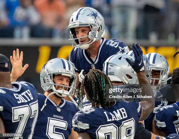 Los Angeles, CA Dallas Cowboys celebrate and hoist kicker Greg Zuerlein up high after Zuerlein kicked a 56 yard field goal to beat the Los Angeles...