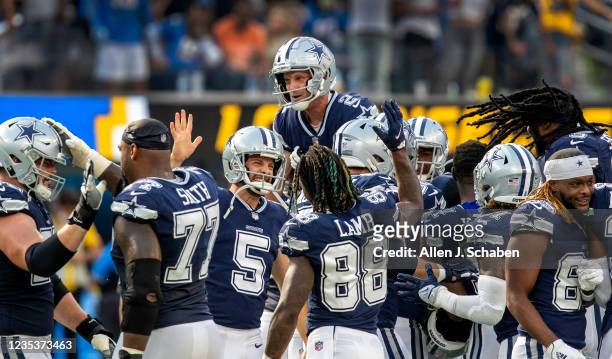 Los Angeles, CA Dallas Cowboys celebrate and hoist kicker Greg Zuerlein up high after Zuerlein kicked a 56 Yd field goal to beat the Los Angeles...